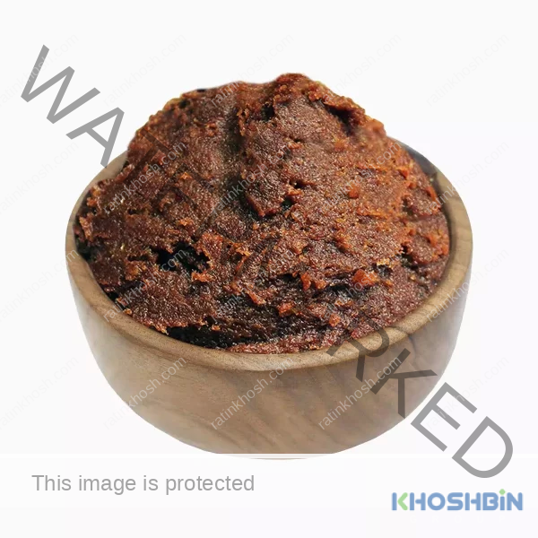 Date paste in a wooden bowl