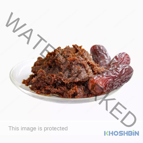 Some date paste and two date fruits on a plate