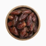 pitted dates in a brown bowl