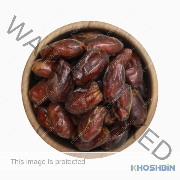 pitted dates in a brown bowl