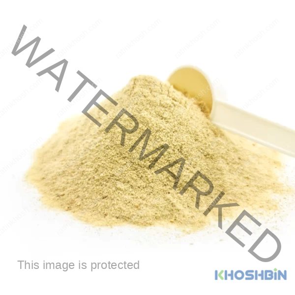 A pile of date sugar and a spoon scooping date powder