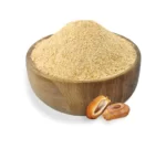 Date sugar in a bowl and two date fruits on the side