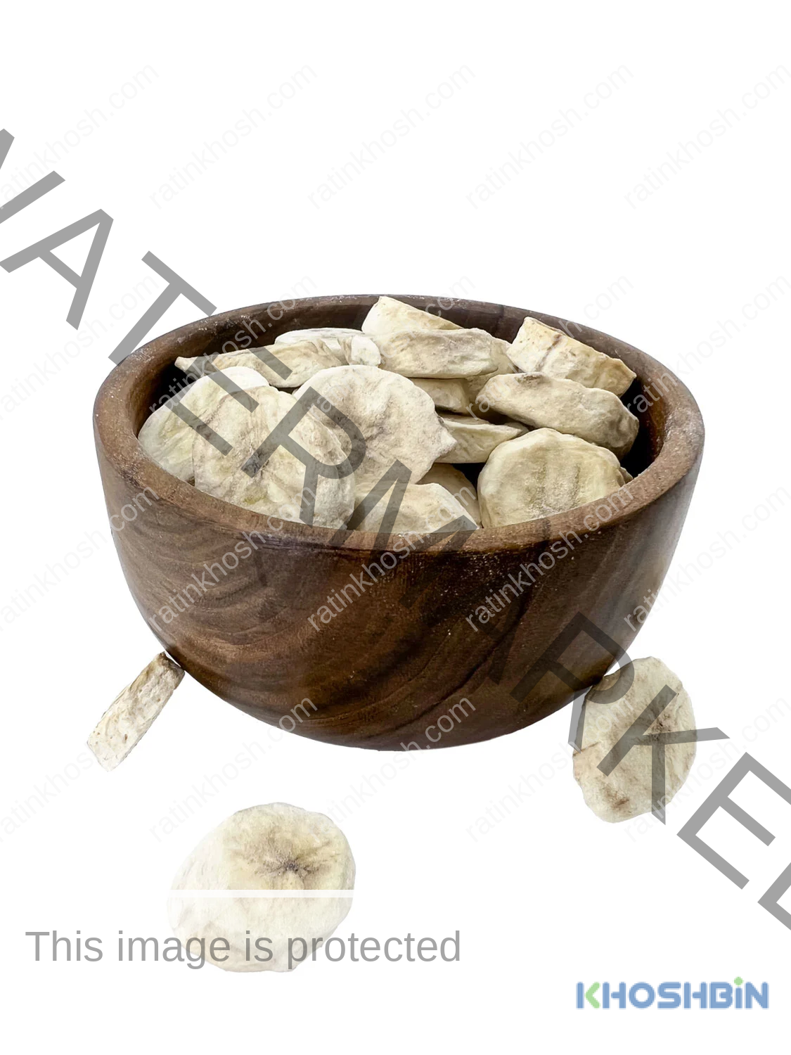 Two slices of freeze dried banana from front view, a bowl full of freeze dried banana slices and a few slices around it