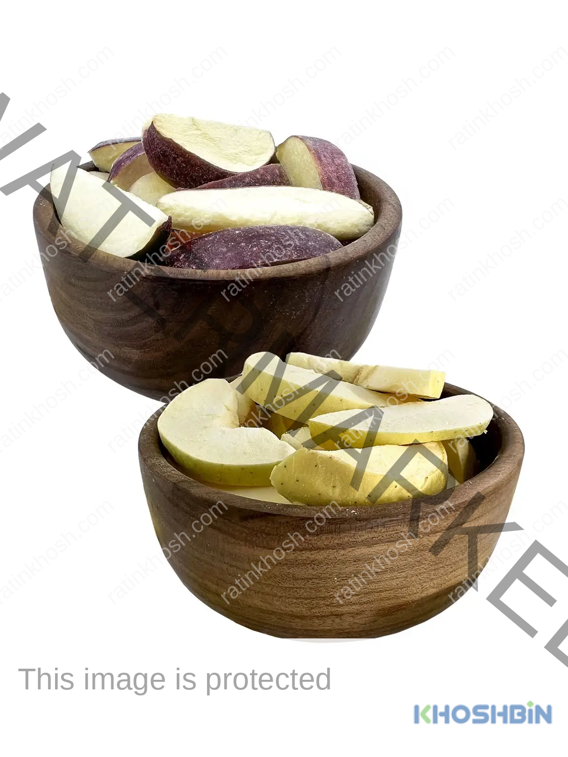 One bowl of freeze dried red apple wedges next to a bowl of yellow apple wedges