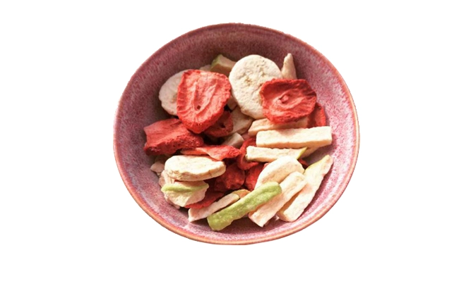 A bowl of salad made with freeze dried strawberry, banana and mango pieces.