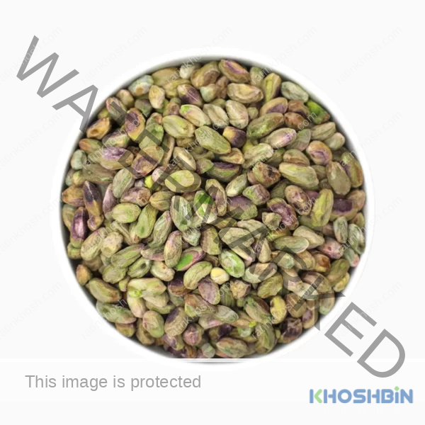 Kaal pistachio kernels in a round bowl from a top view