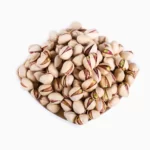 Top view of Fandoghi (round) pistachios in a bowl