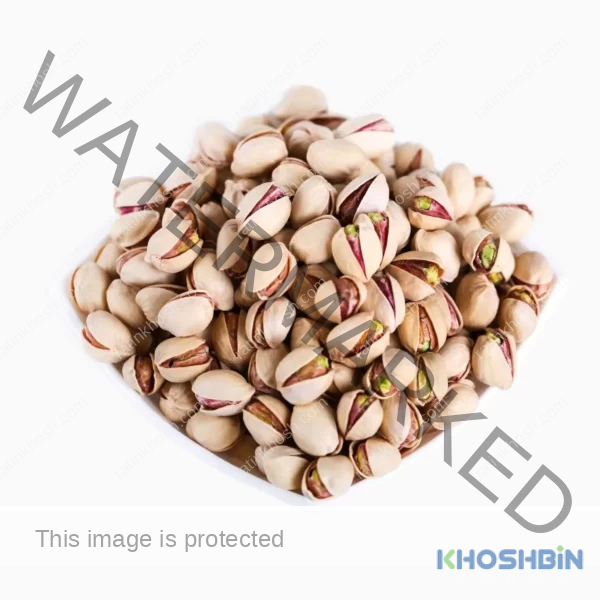 Top view of Fandoghi (round) pistachios in a bowl