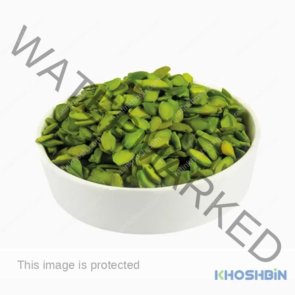 Green psitachio flakes (flaked pistachios) in a round bowl