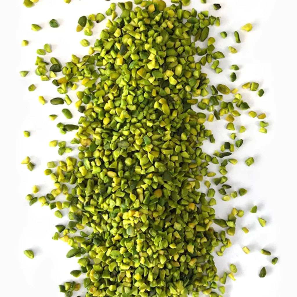 Green chopped pistachios ( 4-6 mm granules) from a close view