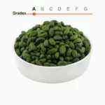 Green peeled pistachio kernels grade A in a wooden ball
