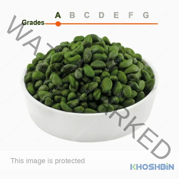 Green peeled pistachio kernels grade A in a wooden ball
