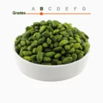 Green peeled pistachio kernels grade B in a wooden ball