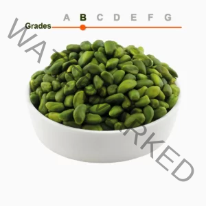 Green peeled pistachio kernels grade B in a wooden ball