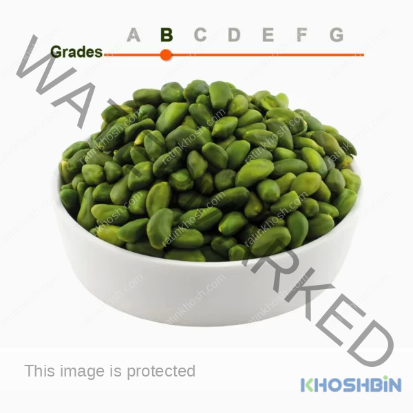 Green peeled pistachio kernels grade B in a wooden ball