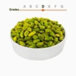 Green peeled pistachio kernels grade D in a wooden ball