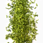 A band of slivered pistachios on a pieace of paper