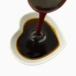 date syrup flowing into a heart-shaeped bowl