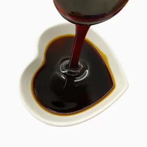 date syrup flowing into a heart-shaeped bowl