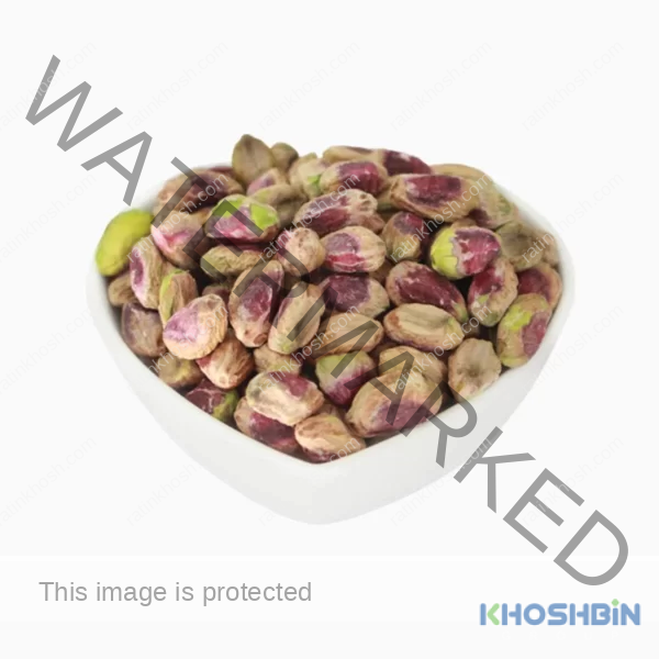 A top view of regular pistachio kernels in a bowl