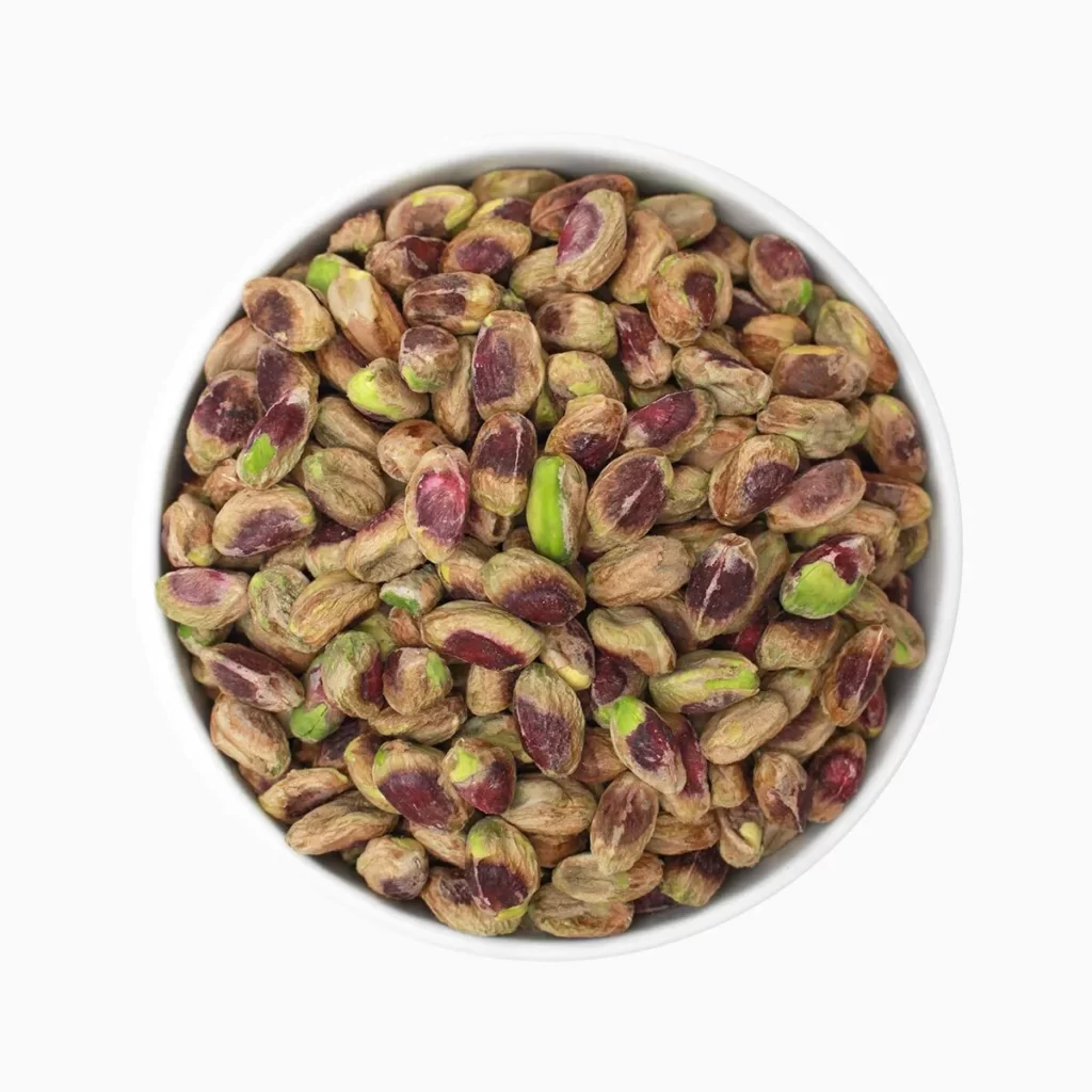 Regular pistachio kernels on a plate.